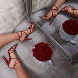 Stiletto heels with pointed cross